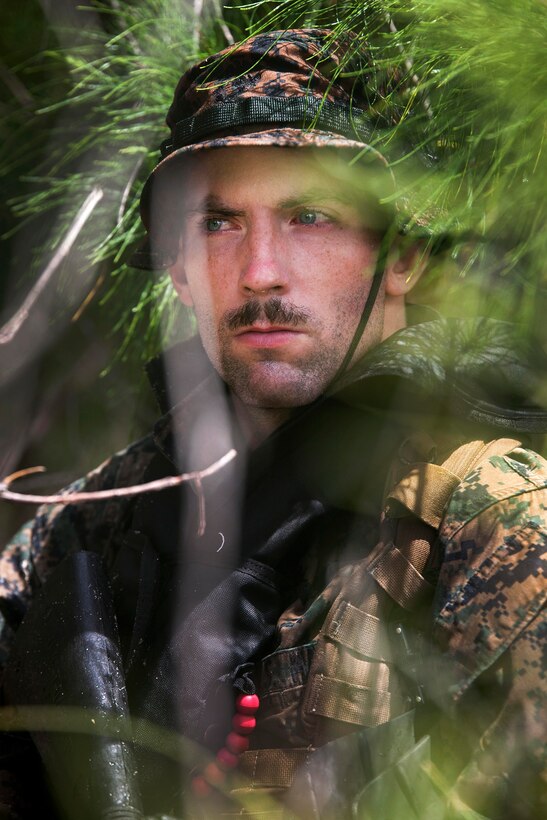 Marine Corps Cpl. Ryan Ehlers stands at the ready during an amphibious exercise at Marine Corps Training Area Bellows, Hawaii, June 15, 2017. Ehlers is a raider reconnaissance team operator assigned to the 3rd Radio Reconnaissance Platoon, 3rd Radio Battalion. Marine Corps photo by Lance Cpl. Luke Kuennen