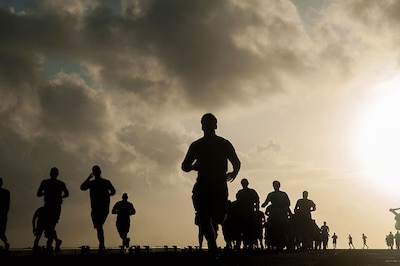 Marines and Sailors aboard amphibious assault ship USS Makin Island run Sexual Assault Awareness and Prevention Month 5K on flight deck, April 21, 2017 (U.S. Navy/Clark Lane)