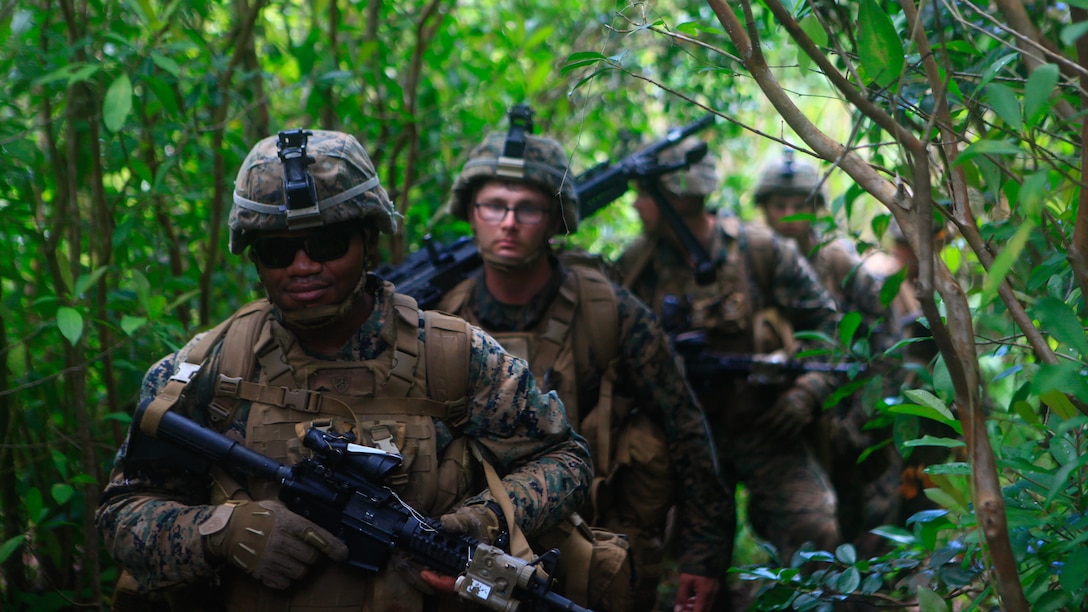 Marines assigned to Lima Company, 3rd Battalion, 3rd Marine Regiment, 3rd Marine Division, patrol through jungle terrain during Exercise Bougainville 1-17.2 at Training Area Kahukus, Hawaii, June 14,  2017. Bougainville is an exercise conducted to enhance the battalion's lethality and effectiveness as a force in readiness. (U.S. Marine Corps photo by Cpl. Alex Kouns)
