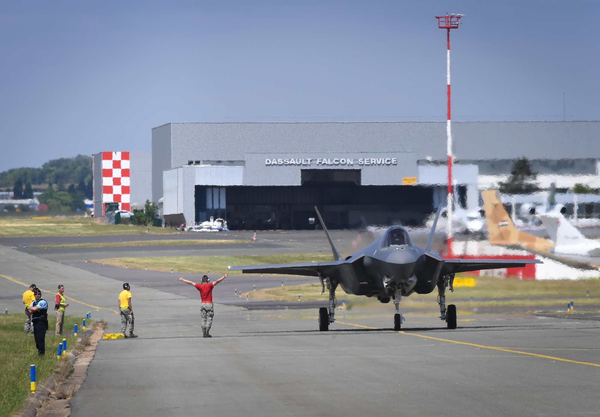 An F-35A Lightning II from Hill Air Force Base, Utah taxis back after performing for a crowd of nearly 100,000 people at Le Bourget Airport, France, during the Paris Air Show, June 23, 2017. The Paris Air Show offers the U.S. a unique opportunity to showcase their leadership in aerospace technology to an international audience. By participating, the U.S. hopes to promote standardization and interoperability of equipment with their NATO allies and international partners. This year marks the 52nd Paris Air Show and the event features more than 100 aircraft from around the world. (U.S. Air Force photo/ Tech. Sgt. Ryan Crane)
