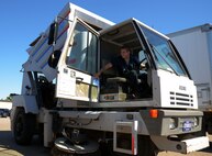 Senior Airman Dalton Dritz, 5th Logistics Readiness Squadron vehicle maintainer, lifts a street sweeper bed at Minot Air Force Base, N.D., June 19, 2017. The 5th LRS vehicle maintainers determine serviceability, overall condition of the vehicles, and need for repair through visual and audio examinations. (U.S. Air Force photo by Airman 1st Class Dillon J. Audit)