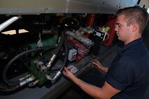 Senior Airman Dalton Dritz, 5th Logistics Readiness Squadron vehicle maintainer, inspects the de-icing and anti-icing pumps on a de-icer at Minot Air Force Base, N.D., June 19, 2017. Vehicle maintenance is performed on various military, commercial and special purpose vehicles, as well as other vehicular equipment. (U.S. Air Force photo by Airman 1st Class Dillon J. Audit)