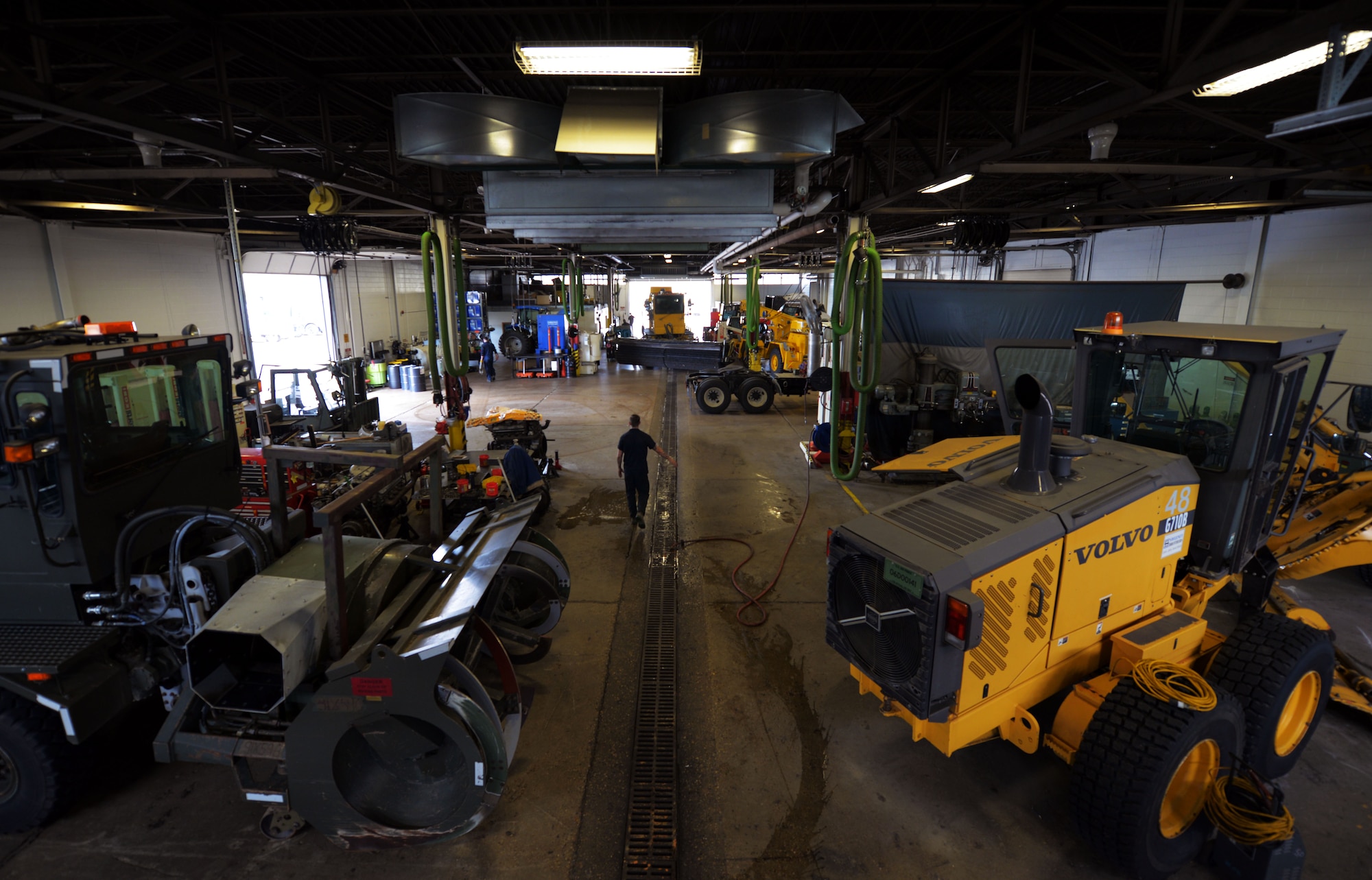 Senior Airman Dalton Dritz, 5th Logistics Readiness Squadron vehicle maintainer, cleans up the special purpose shop at Minot Air Force Base, N.D., June 19, 2017. At the end of the day the Airmen clean the facility to ensure a safe and efficiently-run workplace. (U.S. Air Force photo by Airman 1st Class Dillon J. Audit)