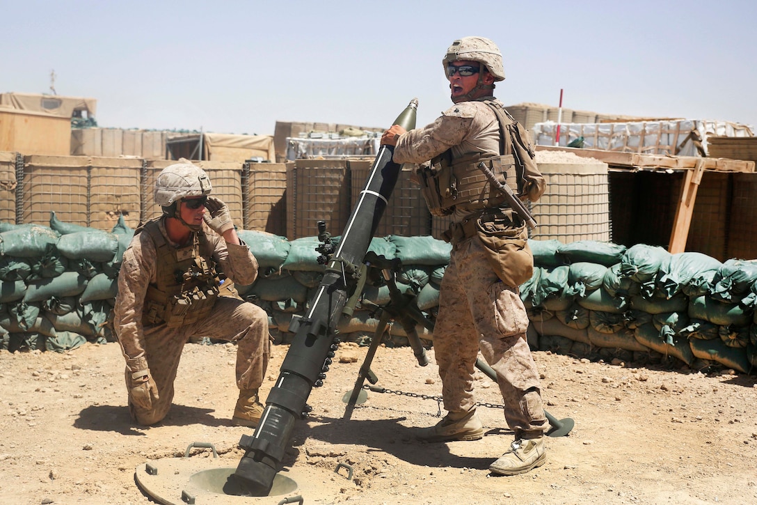 A Marine loads a round into a 120 mm mortar system at Camp Shorab, Afghanistan, June 23, 2017. Marine Corps photo by Sgt. Lucas Hopkins