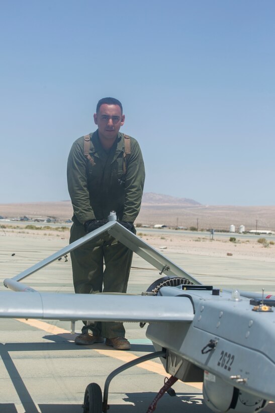 U.S. Marine Corps Lance Cpl. Miguel Salazar, an unmanned aerial vehicle technician with Marine Unmanned Aerial Vehicle Squadron 4, Marine Aircraft Group 41, 4th Marine Aircraft Wing, Marine Forces Reserve, pushes an RQ-7B Shadow towards the hanger after it lands at Camp Wilson, Marine Air Ground Combat Center, Twentynine Palms, California, June 22, 2017, after a reconnaissance mission during Integrated Training Exercise 4-17. VMU-4 provided aerial reconnaissance in support of the 2nd Battalion, 25th Marine Regiment, 4th Marine Division, MARFORRES final battalion exercise of ITX 4-17.  (U.S. Marine Corps photo by Lance Cpl. Imari J. Dubose)