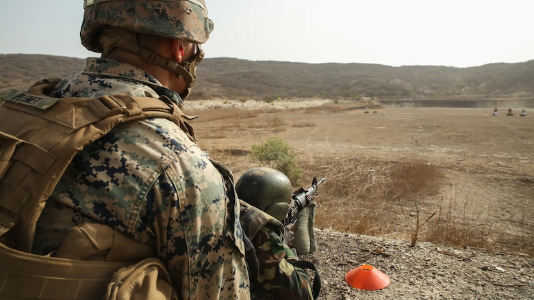 Cpl. Jonah Plemer, a rifleman with Special Purpose Marine Air-Ground Task Force – Crisis Response – Africa, coaches a soldier with Senegal’s 5th Contingent in Mali through an unknown distance range course of fire during a peacekeeping operations training mission at Thies, Senegal, June 9, 2017. Marines and Sailors with SPMAGTF-CR-AF served as instructors and designed the training to enhance the soldiers’ abilities to successfully deploy in support of United Nations peacekeeping missions in the continent. (U.S. Marine Corps photo by Sgt. Samuel Guerra/Released)