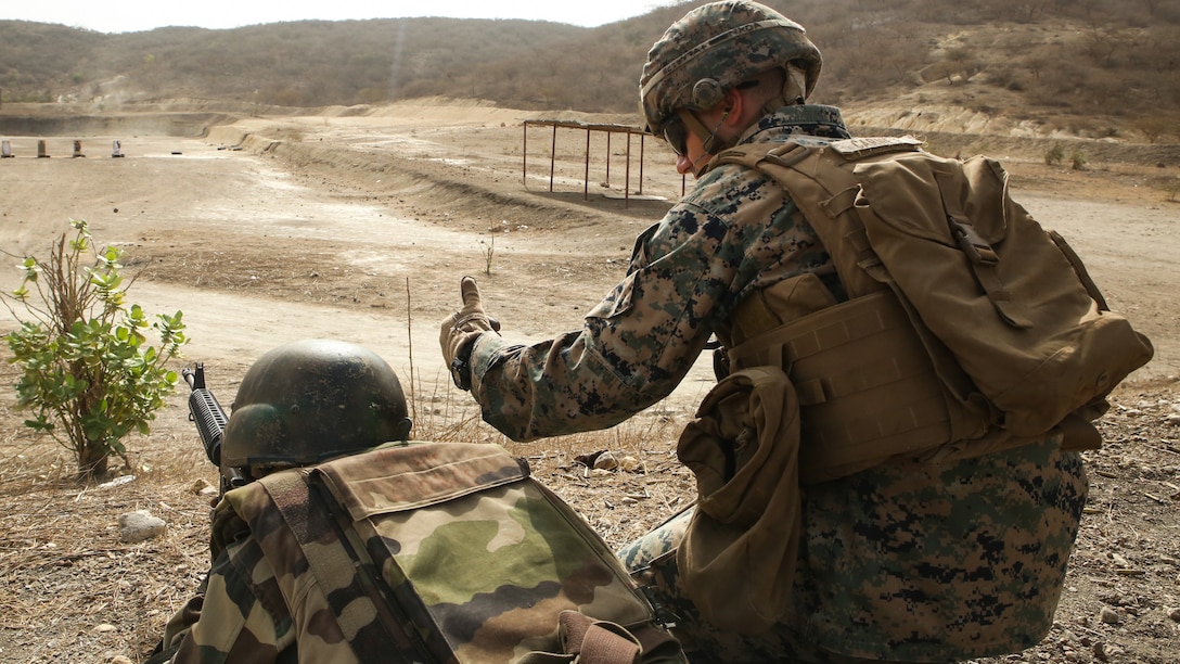Cpl. Seth Carney, a rifleman with Special Purpose Marine Air-Ground Task Force – Crisis Response – Africa, coaches a soldier with Senegal’s 5th Contingent in Mali through an unknown distance range course of fire during a peacekeeping operations training mission at Thies, Senegal, June 9, 2017. Marines and Sailors with SPMAGTF-CR-AF served as instructors and designed the training to enhance the soldiers’ abilities to successfully deploy in support of United Nations peacekeeping missions in the continent. (U.S. Marine Corps photo by Sgt. Samuel Guerra/Released)