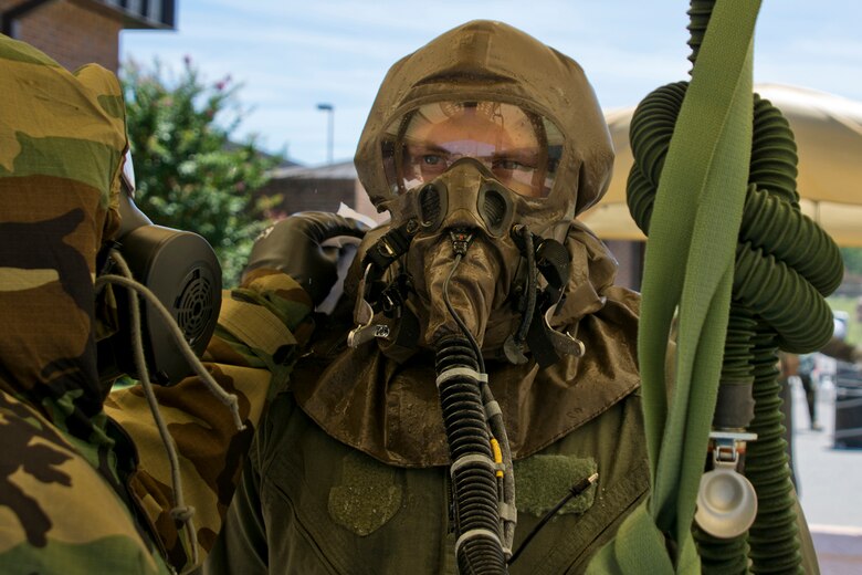 U.S. Air Force Reserve Staff Sgt. Michael Richardson, aircrew flight equipment (AFE) specialist, 913th Operations Support Squadron, uses a towelette to remove simulated contaminants from Staff Sgt. Michael Hopson, loadmaster, 327th Airlift Squadron, during decontamination training for AFE specialist’s June 19, 2017, at Little Rock Air Force Base, Ark. Richardson was one of four AFE Airmen who took part in training to enhance skills needed to protect personnel and equipment so they can work safely and effectively in a contaminated environment. (U.S. Air Force photo by Master Sgt. Jeff Walston/Released)