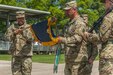 Col. Daryl Hood, 3rd Chemical Brigade commander, left, holds the guidon while Command Sgt. Maj. Jerry Gonzales unfurls the colors for the 2nd Battalion, 48th Infantry Regiment during the battalion activation ceremony Friday. The battalion was activated to support an increase to the installation's Basic Combat Training mission. 

(Photo Credit: Mr. Stephen Standifird (Leonard Wood)