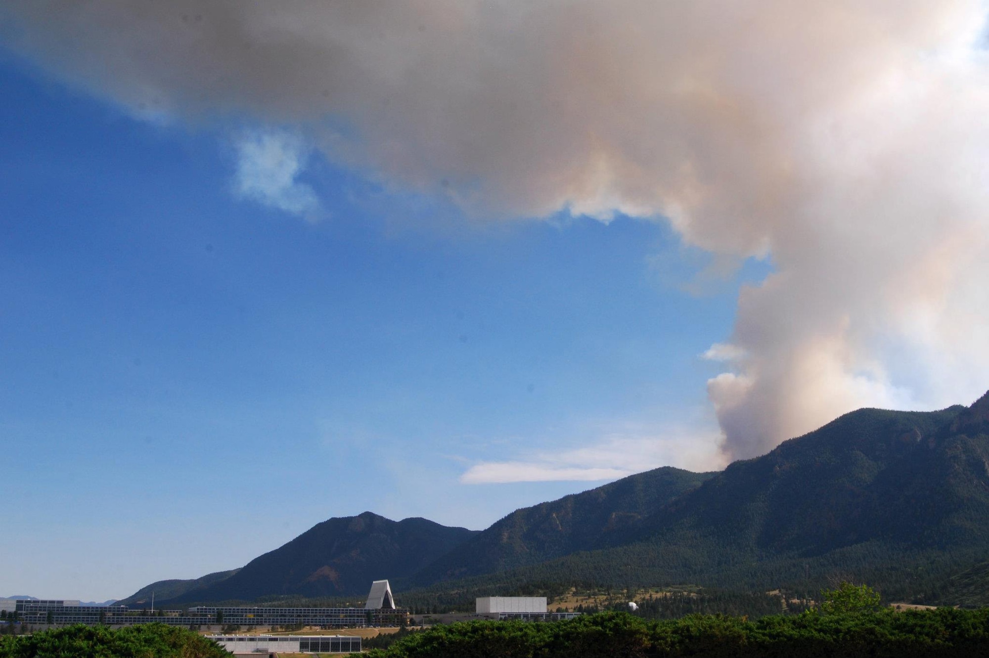 The Waldo Canyon fire burns in the Pike National Forest between the Air Force Academy and Woodland Park, Colo., June 25, 2012. The fire, which started June 23, spread to cover approximately 3,500 acres by the time the photo was taken. As of June 25, the fire was 5-percent contained. (U.S. Air Force photo/Don Branum)