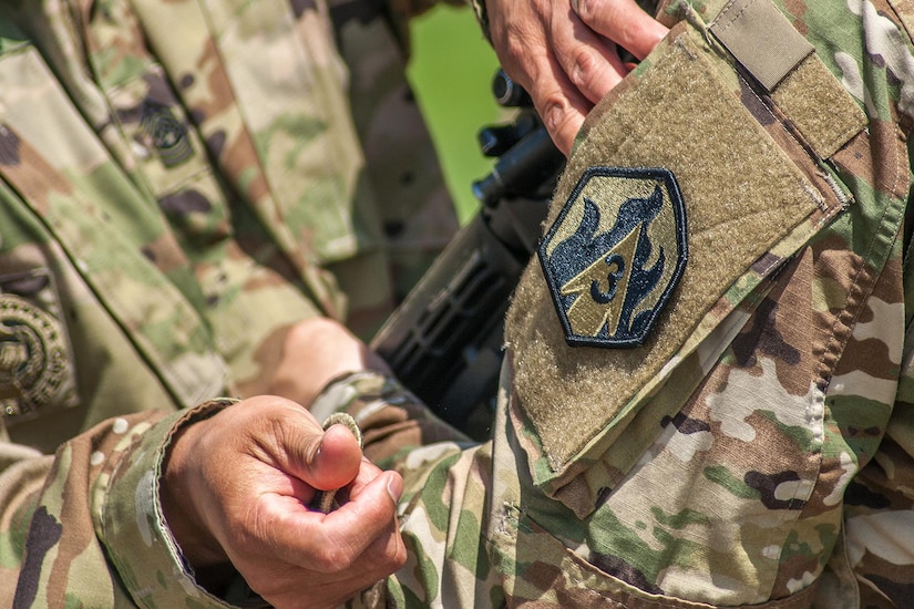 Members of the 2nd Battalion, 48th Infantry Regiment color guard receive their 3rd Chemical Brigade patches during the battalion activation ceremony Friday. 

(Photo Credit: Mr. Stephen Standifird (Leonard Wood)