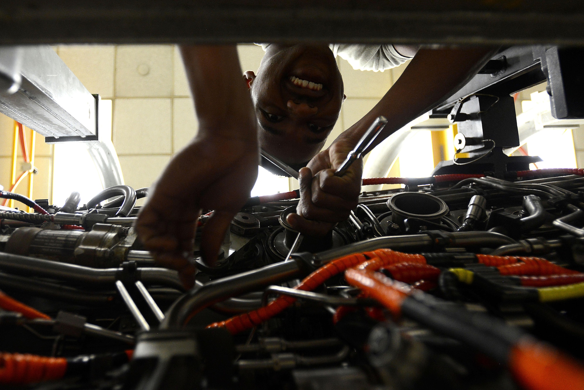 U.S. Air Force Airman 1st Class Justin Tillman, 20th Component Maintenance Squadron aerospace propulsion journeyman, learns how to remove the accessory drive gearbox (ADG) from an F-16CM Fighting Falcon engine during training at the 372nd Training Squadron, Detachment 202 F-16 Field Training Detachment at Shaw Air Force Base, S.C., April 25, 2017. The ADG is responsible for running accessories such as fuel pumps that are essential for the operation of the engine. (U.S. Air Force photo by Senior Airman Kelsey Tucker)