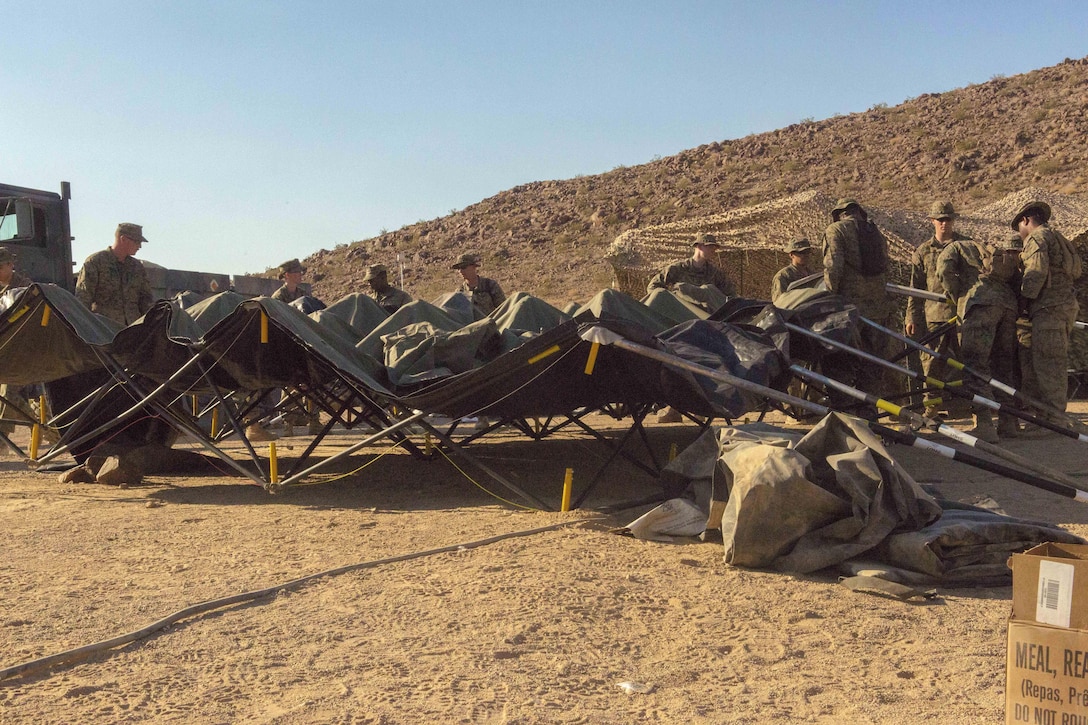 Marines take down a tent during Integrated Training Exercise 4-17 at Twentynine Palms, Calif., June 21, 2017. Marine Corps photo by Pfc. Melany Vasquez