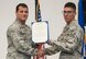 Lt. Col. Matthew Imperial (right), 96th Communication Squadron commander, presents Senior Airman Kyle Belmares, 96th CS cable and antenna systems, with an Air Force Commendation Medal at an awards ceremony June 20 on Eglin Air Force Base, Fla. Belmares was one of two Airmen recognized for life-saving care in response to a severe vehicle accident in February. (U.S. Air Force photo/Jasmine Porterfield)