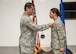 Lt. Col. Matthew Imperial (right), 96th Communication Squadron commander, presents Airman 1st Class Jaylyn Smith, 96th CS cable and antenna systems, with an Air Force Commendation Medal at an awards ceremony June 20 on Eglin Air Force Base, Fla. Smith was one of two Airmen recognized for life-saving care in response to a severe vehicle accident in February. (U.S. Air Force photo/Jasmine Porterfield)