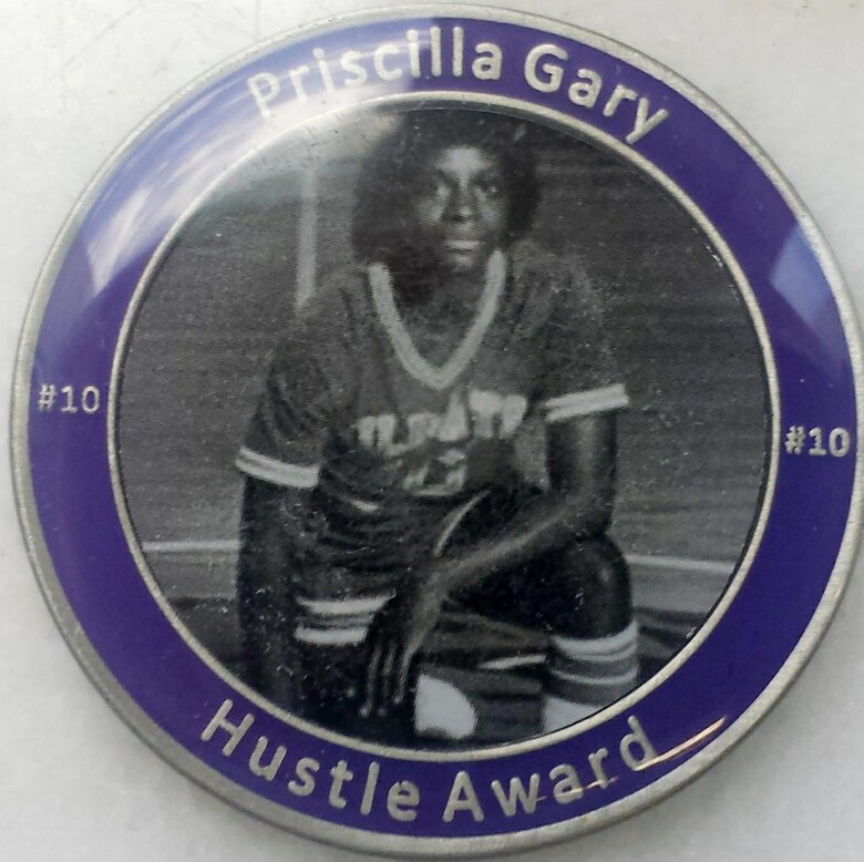 Heads side of the Priscilla Gary Hustle Award Coin which is given each year to the player who most demonstrates the hustle Sweeney exemplified.