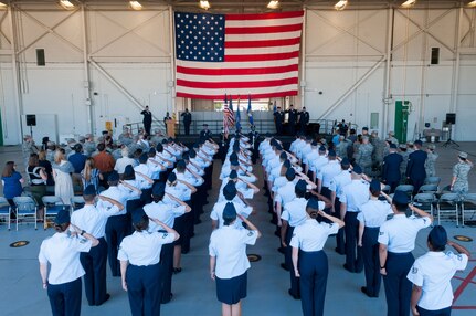 Staff Sgt. Tinese Jackson, 9th Intelligence Squadron optical bar camera mission manager, sings the national anthem during the presentation of the colors during a change of command ceremony at Beale Air Force Base, Calif., June 14, 2017. The change of command ceremony represents the formal passing of responsibility, authority and accountability of command from one officer to another. (U.S. Air Force photo by Senior Airman Lauren Parsons/Released)