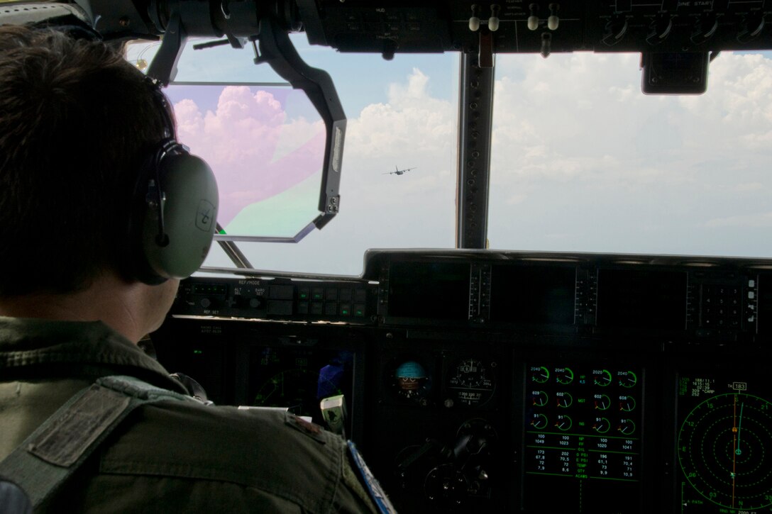 U.S. Air Force Reserve Maj. Peter Hughes, pilot, 327th Airlift Squadron, flies a C-130J Super Hercules June 15, 2017, near Little Rock Air Force Base, Ark. The 3-ship sortie, manned entirely by Reserve Airmen, was a first for the 913th Airlift Group. (U.S. Air Force photo by Master Sgt. Jeff Walston/Released)