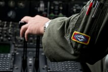 U.S. Air Force Reserve Lt. Col. Chris Dickens, assistant operations officer, 327th Airlift Squadron, takes control of a C-130J Super Hercules throttle during a flight near Little Rock Air Force Base, Ark., June 15, 2017. Dickens was part of the 913th Airlift Group’s first 3-ship mission manned entirely by Reserve Airmen. (U.S. Air Force photo by Master Sgt. Jeff Walston/Released)
