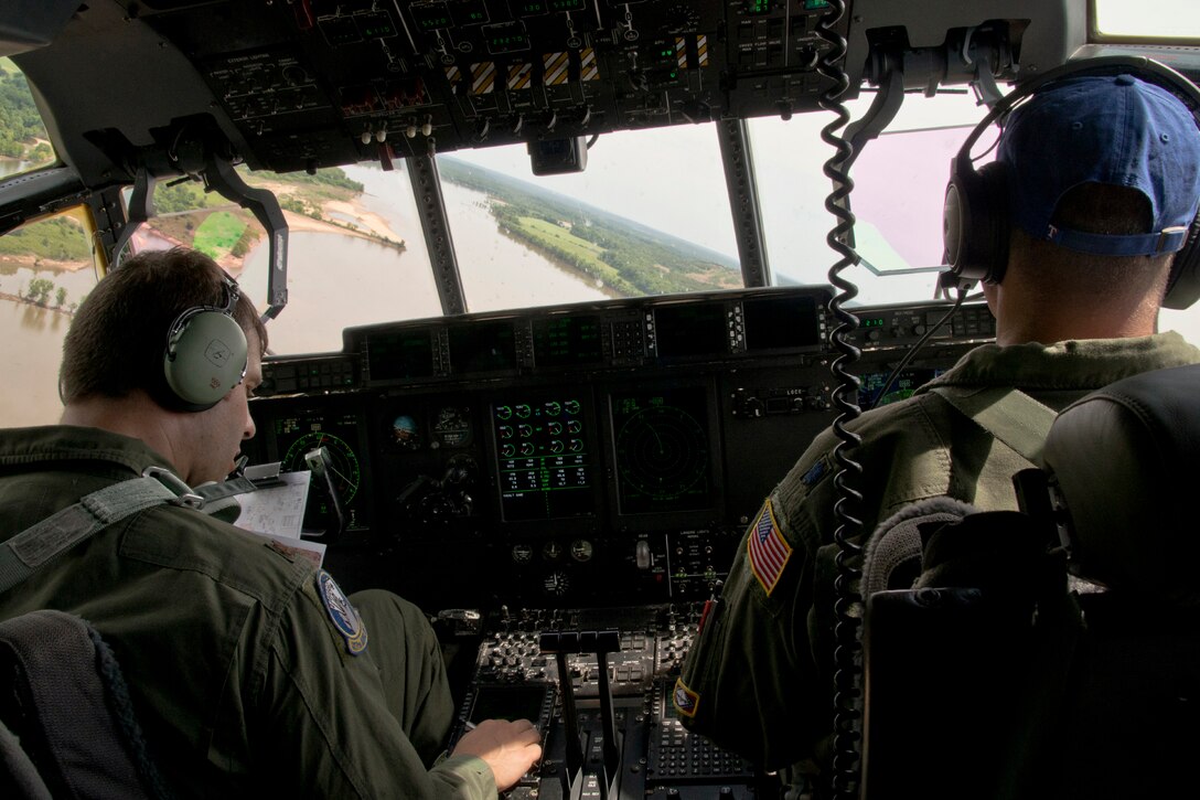 U.S. Air Force Reserve Maj. Peter Hughes, and Lt. Col. Chris Dickens, pilots assigned to the 327th Airlift Squadron, fly a C-130J Super Hercules during the 913th Airlift Group’s first 3-ship mission manned entirely by Reserve Airmen June 15, 2017, near Little Rock Air Force Base, Ark. Hughes and Dickens joined two additional aircrews that were part of the Group’s first 3-ship sortie manned entirely by Reserve Airmen. (U.S. Air Force photo by Master Sgt. Jeff Walston/Released)