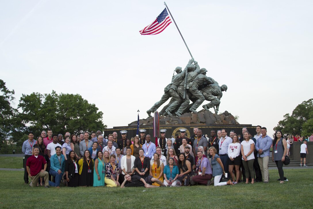Approximately 50 collegiate educators pose for a photo with Marines after the Sunset Parade ended as part of the Officer Selection Officers’ Educators’ and Key Leaders’ Workshop in Arlington, Va., June 20, 2017. During the engagement, the attendees learned about officer programs for their students,  conducted patrols, negotiated the Leadership Reaction Course and experienced several other events. The purpose of the workshop is to create mutually beneficial relationships between the educators and the Marine Corps so the collegiate leaders can share their knowledge with their students based on first-hand experiences.
