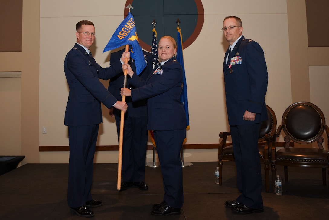 Lt. Col. Danielle R. Kirk, 460th Logistics Readiness Squadron incoming commander, receives the guidon, symbolizing the official change of command June 23, 2017, on Buckley Air Force Base, Colo.  Kirk is now the commander of a squadron that provides logistics support for over 6,000 personnel. (U.S. Air Force photo by Airman 1st Class Holden S. Faul/ released)