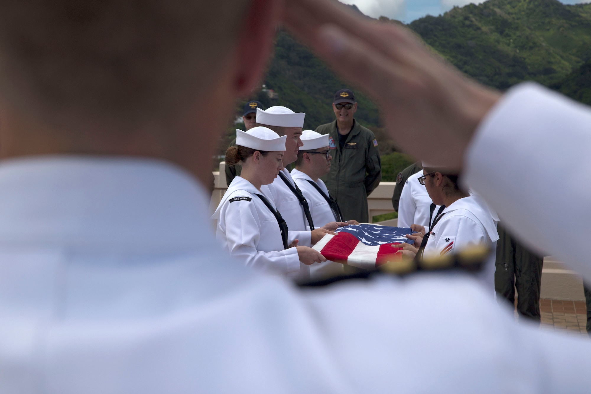 Commander Adam Hancock, Operations Officer of Strategic Communications Wing One and former VQ-3 Commanding Officer, speaks to Sailors during the Crew 4 memorial ceremony in Honolulu.  (U.S. Navy photo by Petty Officer 1st Class Cody R. Boyd)