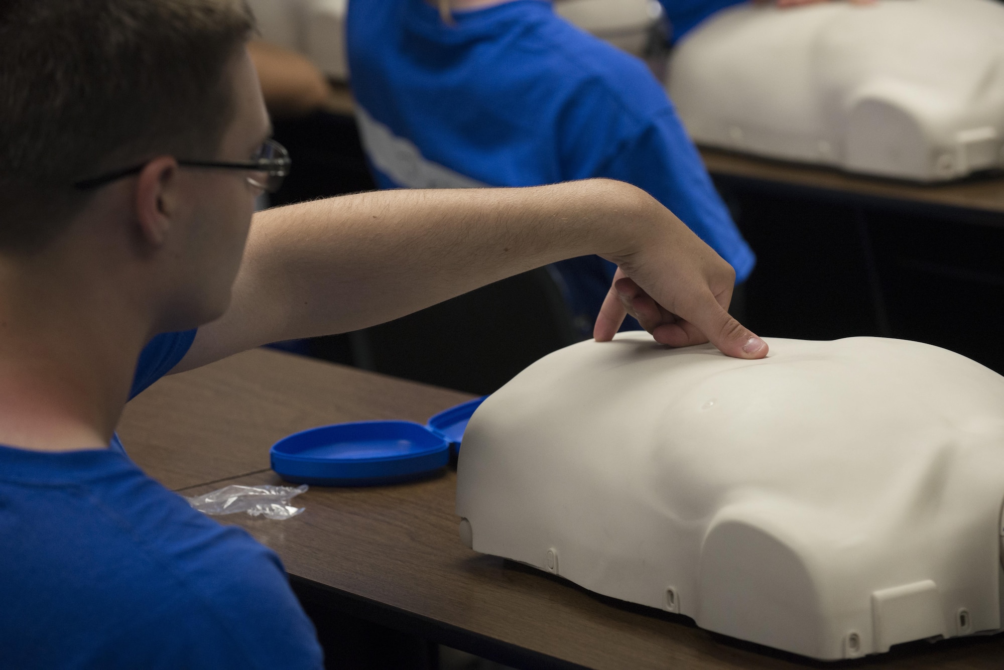 A Junior ROTC cadet measures the correct location for chest compressions while performing CPR during the Delaware Cadet Leadership Course June 21, 2017, at the Delaware National Guard training site at Bethany Beach, Del. The week-long camp is Delaware Junior ROTC’s equivalent to the Air Force’s Basic Military Training. (U.S. Air Force photo by Staff Sgt. Jared Duhon)