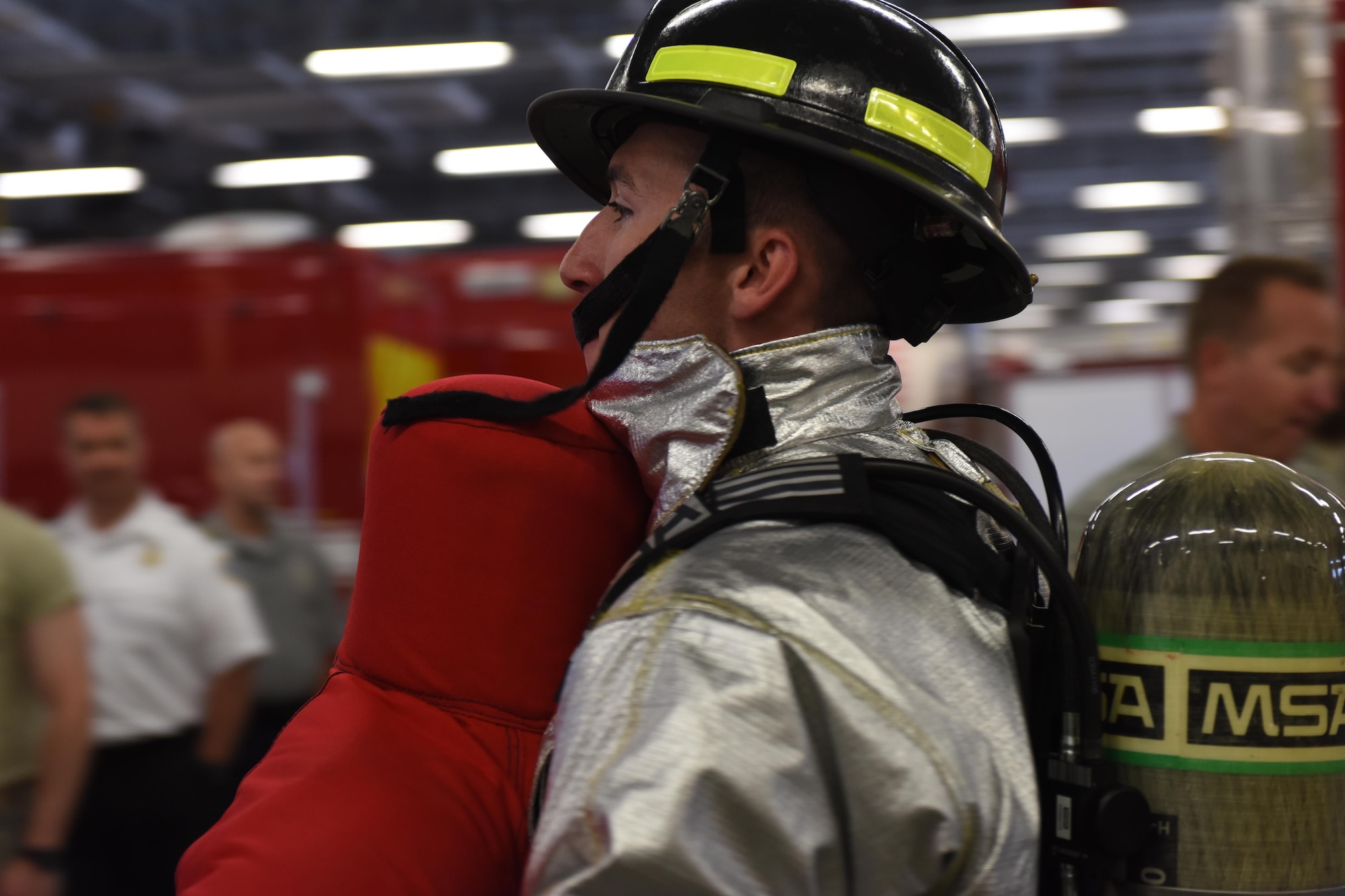 Jesse Haggerty, U.S. Air Force Academy cadet, carries a 150-pound test dummy through an obstacle course at the 4th Civil Engineer Squadron fire department, June 8, 2017, at Seymour Johnson Air Force Base, North Carolina. Haggerty was one of 10 cadets who participated in Operation Air Force, a 2 1/2-week program held in the summer for USAFA cadets and Air Force Reserve Officer Training Corps cadets. (U.S. Air Force photo by Airman 1st Class Miranda A. Loera)