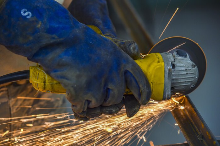 Airman 1st Class Wayne Lee, 628th Civil Engineer Squadron structural apprentice, cuts an angle iron for a table leg at Joint Base Charleston, S.C., June 23, 2017. The 628th CES structures shop helps maintain structures, such as buildings and other government property, across the Air Base and Weapons Station.