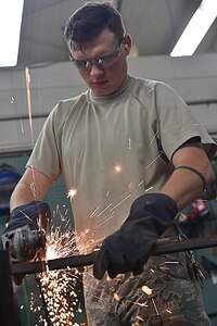 Airman 1st Class Wayne Lee, 628th Civil Engineer Squadron structural apprentice, cuts an angle iron for a table leg at Joint Base Charleston, S.C., June 23, 2017. The 628th CES structures shop is responsible for constructing, maintaining, planning and repairing structures, such as buildings and other government property.