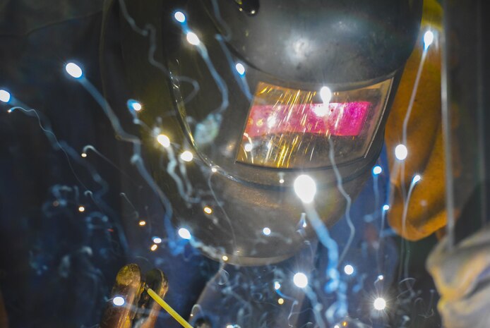 Airman 1st Class Wayne Lee, 628th Civil Engineer Squadron structural apprentice, welds an angle iron for a table leg at Joint Base Charleston, S.C., June 23, 2017. The 628th CES is also responsible for fabricating and repairing components of buildings, utility systems and property equipment.
