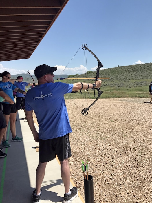 Following lunch with Utah Army and Air National Guardsmen, Air Force Vice Chief of Staff Gen. Stephen W. Wilson tested out the adaptive archery equipment at the National Ability Center in Park City, Utah on June 21, 2017. The National Ability Center, a nonprofit organization that provides adaptive recreation opportunities for individuals of all abilities through sports, activities and education,  was one stop on Wilson's multi-day visit to the state. (U.S. Air National Guard photo by Maj. Jennifer Eaton)