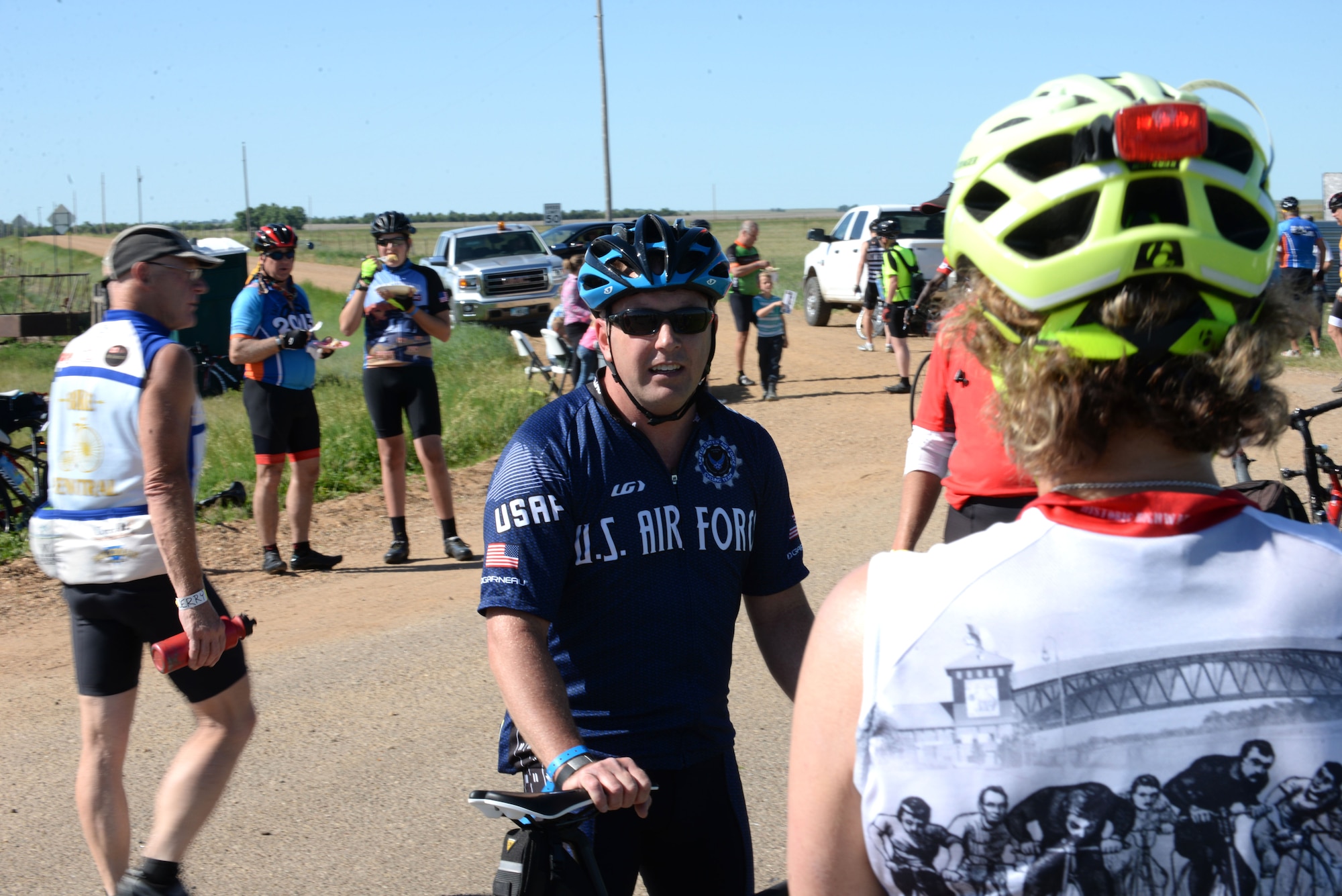 Maj. Anthony Bares, the director of wing inspections assigned to the 28th Bomb Wing Inspector General office, speaks with participants of the Ride Across South Dakota off Highway 44, S.D., June 4, 2017. Bares took up cycling in 2004 as a way to train for triathlons, and leads the Dakota Regional Air Force Cycling Team. (U.S. Air Force photo by Airman 1st Class Thomas Karol)
