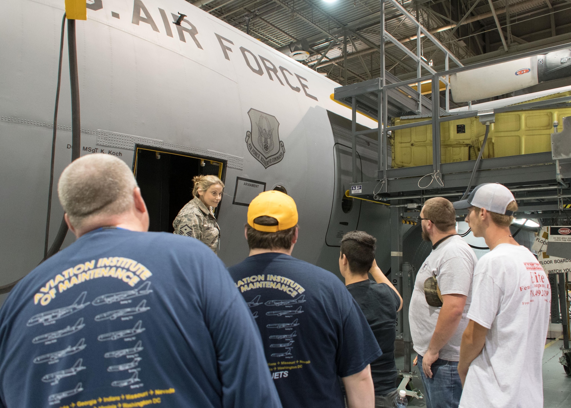 Master Sgt. Noelle Urbach, 94th Maintenance Squadron first sergeant, talks with a group of Aviation Institute of Maintenance students in a hangar here June 23, 2017. Urbach and a crew chief from the squadron answered the students’ questions about the C-130H Hercules. (U.S. Air Force photo/Staff Sgt. Andrew Park)
