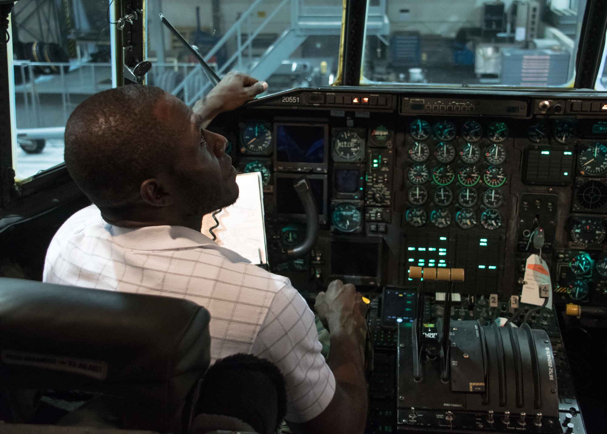 A student from the Aviation Institute of Maintenance school sits in the cockpit of a C-130H3 Hercules at Dobbins Air Reserve Base, Ga. June 23, 2017. In addition to asking maintainers about repairing the C-130, students had the opportunity to tour the aircraft as well. (U.S. Air Force photo/Staff Sgt. Andrew Park)
