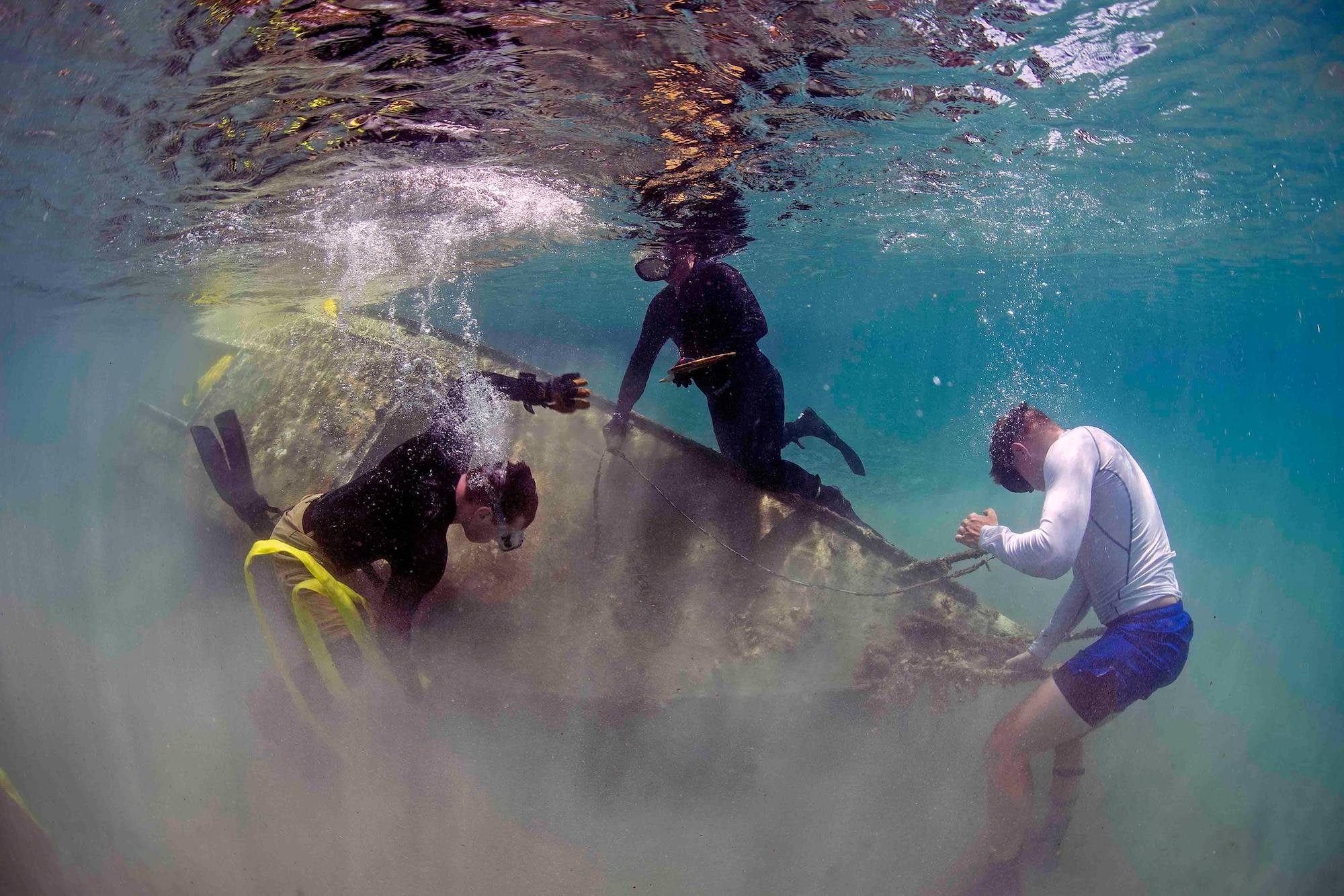 Explosive Ordnance Disposal Technician 2nd Class Mike Jones, assigned to Explosive Ordnance Disposal Mobile Unit (EODMU) 5, dives off the coast of Guam June 12, 2017, as part of the Western Pacific Naval Symposium Diving Exercise (WPNS-DIVEX) 2017. WPNS-DIVEX 2017 is a biennial diving exercise conducted by WPNS nations to enhance cooperation, interoperability, and tactical proficiency in diving operations in support of disaster response.