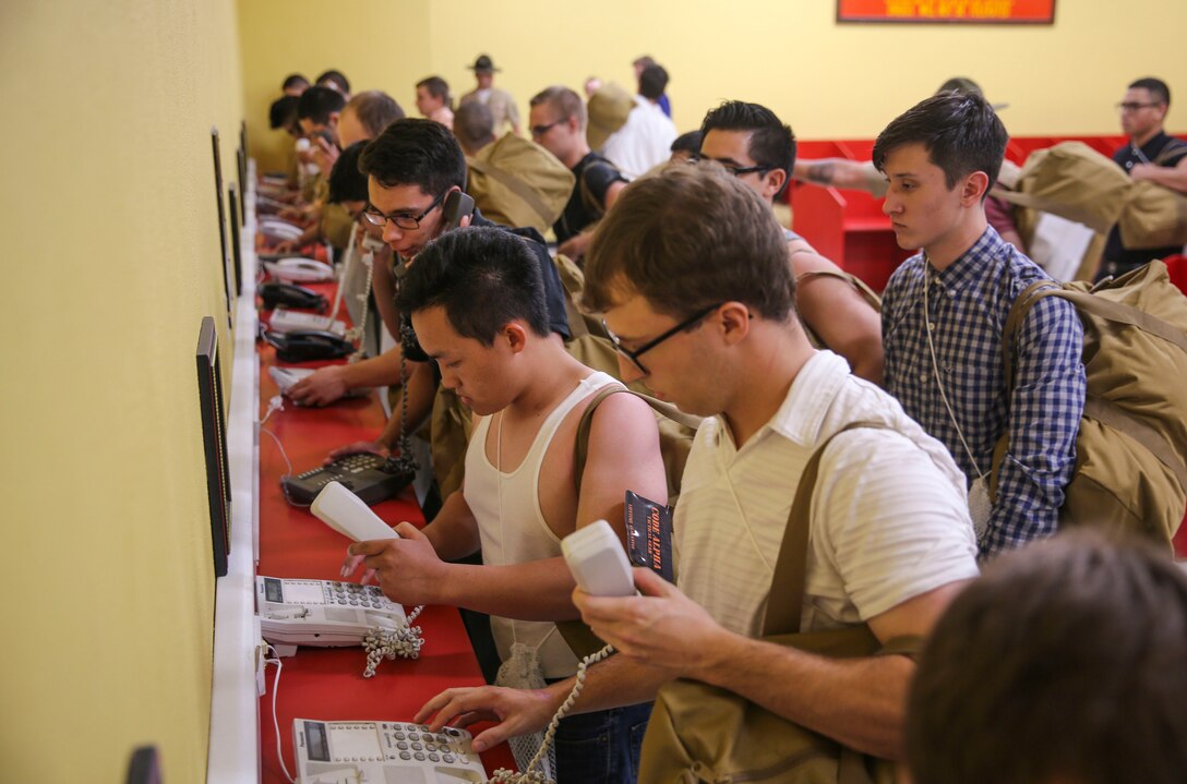 Recruits from Alpha Company, 1st Recruit Training Battalion, make their phone calls home, reading only what is printed on the script in front of them, during receiving at Marine Corps Recruit Depot San Diego, May 8. Recruits will not be able to make another phone call until the end of recruit training. Annually, more than 17,000 males recruited from the Western Recruiting Region are trained at MCRD San Diego. Alpha Company is scheduled to graduate Aug. 4.