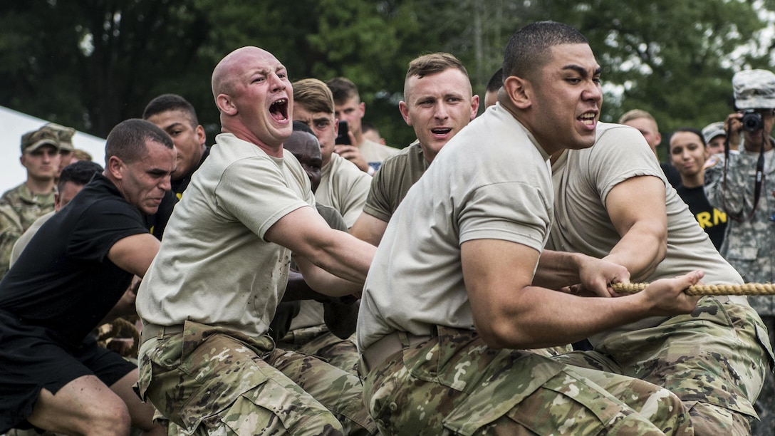 Soldiers and Marines compete in a tug-of-war challenge during the 4th annual Urban Warrior Challenge at Joint Base Myer-Henderson Hall, Va., June 22, 2017. The competition builds team cohesion and 
camaraderie. Army Photo by Sgt. George Huley