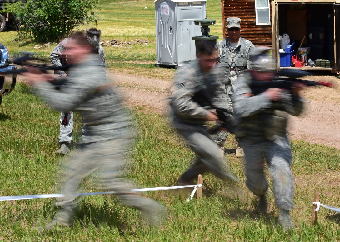 Airmen assigned to the 28th Civil Engineer Squadron practice building breaching techniques at a South Dakota National Guard training site June 19, 2017. The Airmen participated in numerous activities to prepare for future deployments and combat situations. (U.S. Air Force photo by Senior Airman James L. Miller)