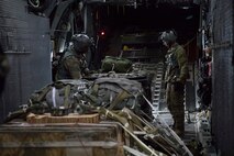 Loadmasters with the 353rd Special Operations Group check bundles while flying over Shizuoka prefecture, Japan, June 15, 2017, during Exercise Teak Jet. Loadmasters conducted low-cost, low-altitude, low-velocity, and high-velocity airdrops over the Combined Arms Training Center, Camp Fuji.  (U.S. Air Force photo by Yasuo Osakabe)