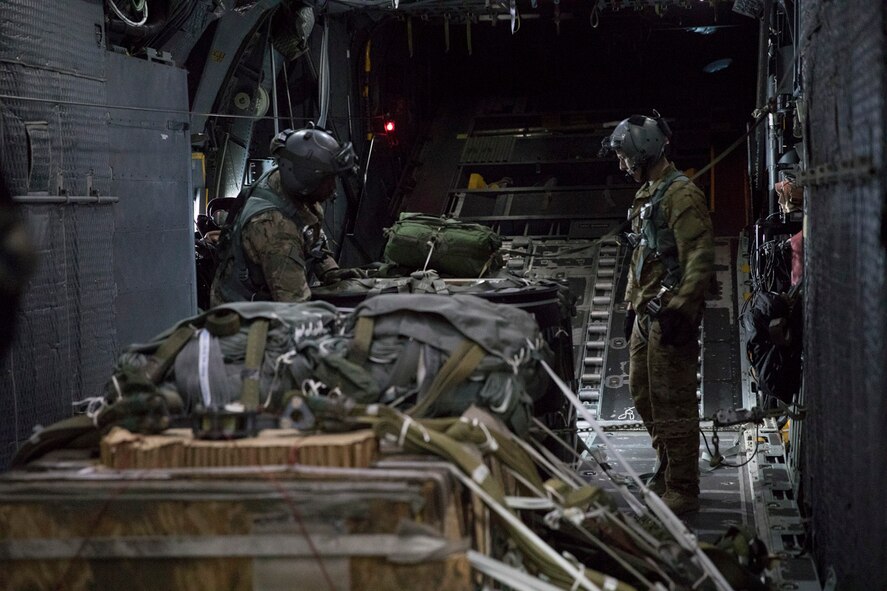Loadmasters with the 353rd Special Operations Group check bundles while flying over Shizuoka prefecture, Japan, June 15, 2017, during Exercise Teak Jet. Loadmasters conducted low-cost, low-altitude, low-velocity, and high-velocity airdrops over the Combined Arms Training Center, Camp Fuji.  (U.S. Air Force photo by Yasuo Osakabe)