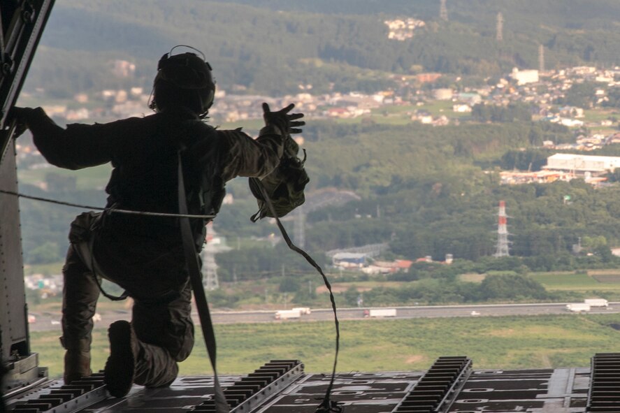 A U.S. Air Force MC-130H Combat Talon II loadmaster with the 353rd Special Operations Group conducts a sandbag airdrop over the Combined Arms Training Center, Camp Fuji, Japan, June 15, 2017, during Exercise Teak Jet. Exercise Teak Jet is a joint combined exchange training (JCET) focused on improving interoperability between the U.S. Air Force and Japan Air Self-Defense Force. (U.S. Air Force photo by Yasuo Osakabe)
