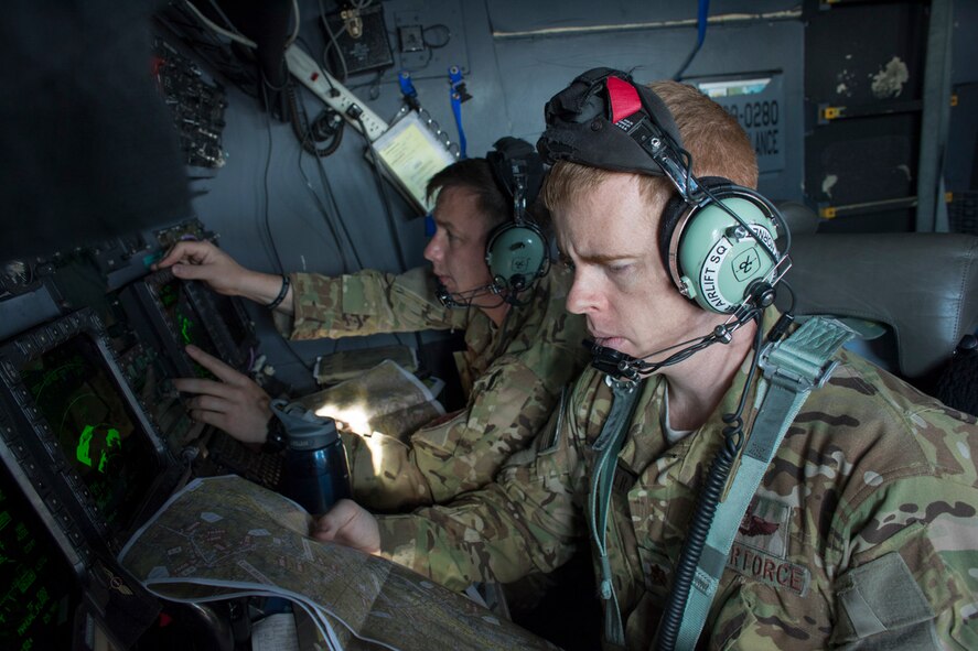 A U.S. Air Force MC-130H Combat Talon II navigator and electronic warfare officer perform navigation during a training mission over the Hida Mountains, June 19, 2017. The Hida Mountains, also known as Northern Alps, are a series of mountain ranges which include several peaks exceeding over 10.000 ft. in height.(U.S. Air Force photo by Yasuo Osakabe)
