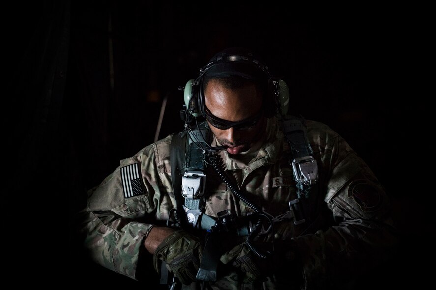 A U.S. Air Force MC-130H Combat Talon II loadmaster from the 353rd Special Operations Group secures a harness before conducting a helicopter air-to-air refueling over the Sea of Japan, June 19, 2017, during Exercise Teak Jet. Exercise Teak Jet is a joint combined exchange training (JCET) focused on improving interoperability between the U.S. Air Force and Japan Air Self-Defense Force. (U.S. Air Force photo by Yasuo Osakabe)