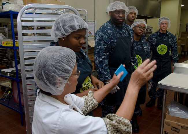 170623-N-YM720-047
PORTLAND, Ore. (June 23, 2017) - Sailors from the submarine tender USS Frank Cable (AS 40) receive instructions from an employee at Meals on Wheels resource center in Portland, June 23.  The Sailors volunteered in the kitchen to help prepare food, package the meals, clean dishes and other various tasks.  Frank Cable is in Portland, Ore. for a scheduled dry-dock phase maintenance availability. (U.S. Navy photo by Mass Communication Specialist 2nd Class Allen Michael McNair/Released)
