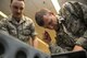 U.S. Air Force Airman 1st Class Austin Lebrun, left, 52nd Operations Support Squadron aircrew flight equipment technician, watches Lt. Col. Joshua Kubacz, right, 52nd OSS commander, pack an ejection chair during the commander’s parachute shop familiarization tour at Spangdahlem Air Base, Germany, June 23, 2017. During the tour, the 52nd OSS commander competed with the first sergeant to see who could pack a parachute the fastest and with the fewest discrepancies. (U.S. Air Force photo by Senior Airman Preston Cherry)