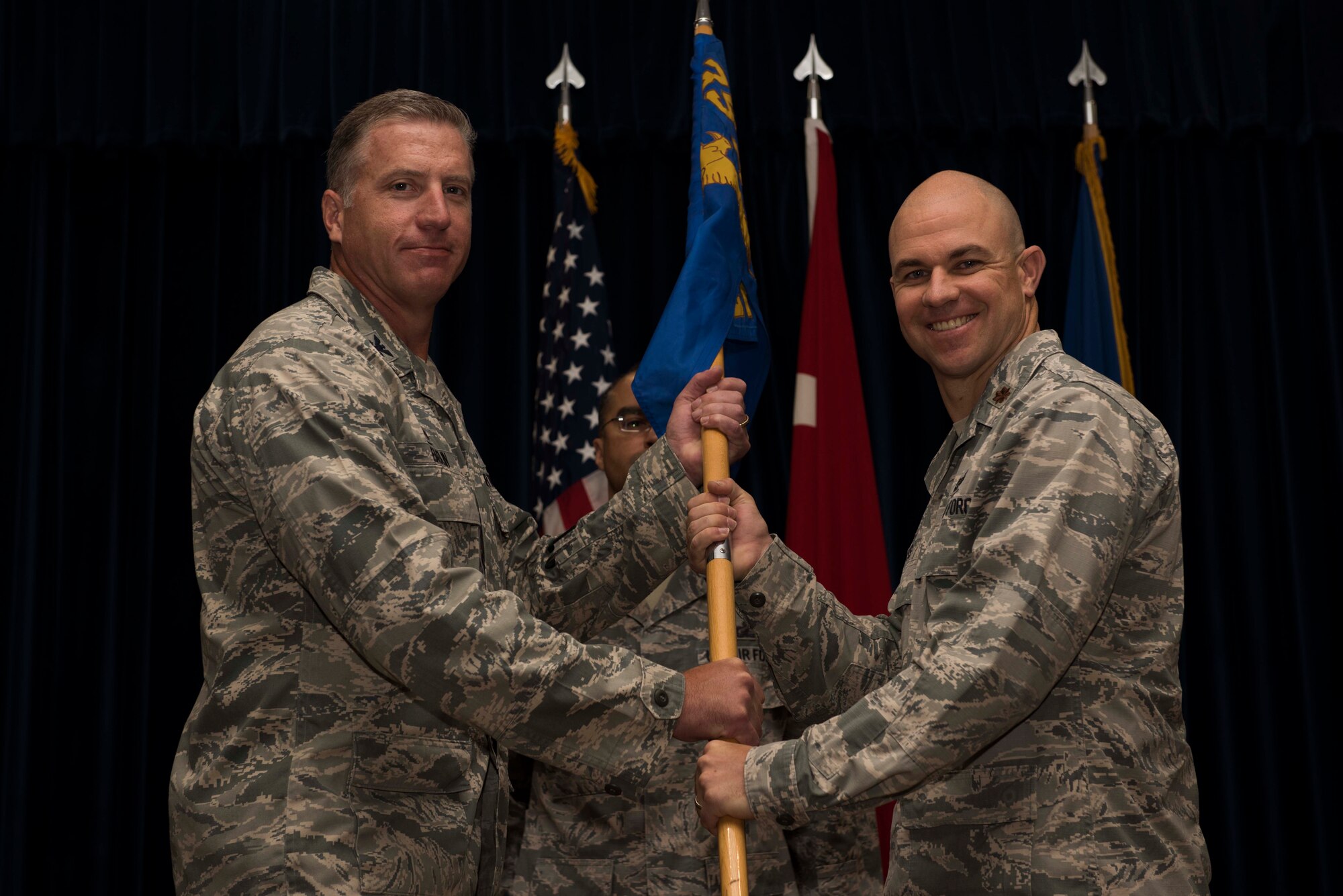 U.S. Air Force Maj. Tyler Hess (right), 39th Comptroller Squadron incoming commander, assumes command from Col. David Eaglin, 39th Air Base Wing commander, June 26, 2017, at Incirlik Air Base, Turkey. A change of command ceremony is a tradition that represents a formal transfer of authority and responsibility from the outgoing commander to the incoming commander. (U.S. Air Force photo by Airman 1st Class Devin M. Rumbaugh) 