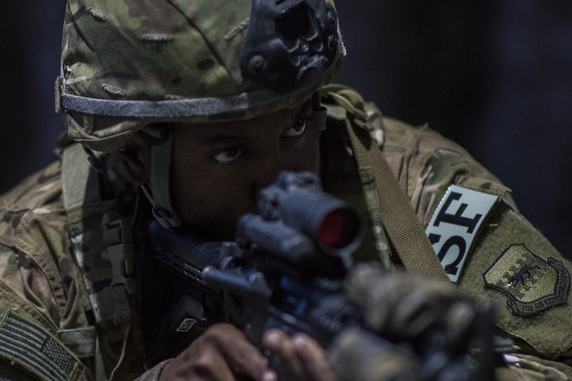 A member of the 332nd Expeditionary Security Forces Squadron takes point during an active-shooter exercise June 8, 2017, in Southwest Asia. The security forces members searched the area for any threats, ensuring the scene was secure before medical teams arrived to treat the simulated victims. (U.S. Air Force photo/Senior Airman Damon Kasberg)