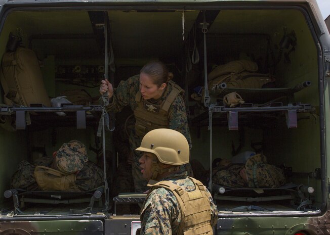 U.S. Navy Petty Officer 3rd Class Rebecca Hurst and Petty Officer 2nd Class Kris Tortuguerrez, corpsmen with Marine Wing Support Squadron (MWSS) 171, based out of Marine Corps Air Station Iwakuni, prepare to transport casualties via ambulance during an unexpected mass casualty drill while participating in exercise Eagle Wrath 2017 at Combined Arms Training Center Camp Fuji, Japan, June 15, 2017. The purpose of the drill was to see how medical personnel react in coalition with the Marines to make sure they are working in a fluid manner. Eagle Wrath 2017 is a two-week training evolution focusing on air base ground defense and establishing a forward operating base in an austere environment. (U.S. Marine Corps photo by Lance Cpl. Stephen Campbell)